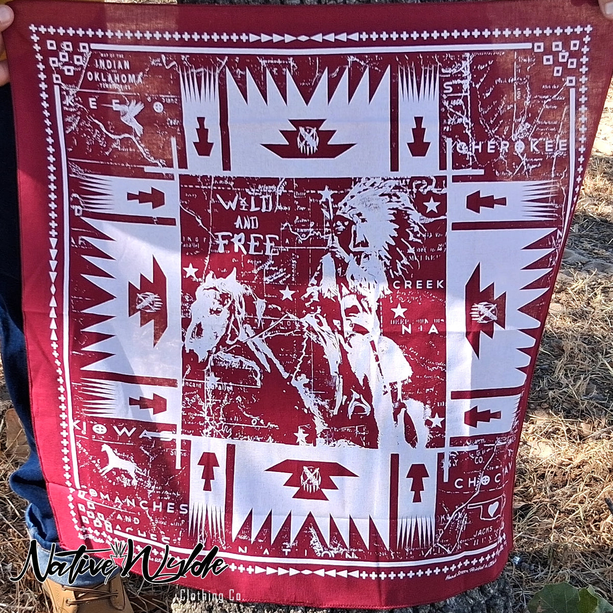 A square red and white bandana featuring a distressed Native American and cowboy motif with the words 'WILD AND FREE' and 'CHEROKEE'.