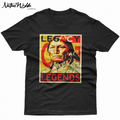 A black short-sleeve crewneck t-shirt featuring a large graphic print on the front. The graphic is a square with the text 'LEGACY LEGENDS' in bold red and yellow lettering, surrounding a portrait of a Native American man wearing a black beaded headband and traditional clothing.