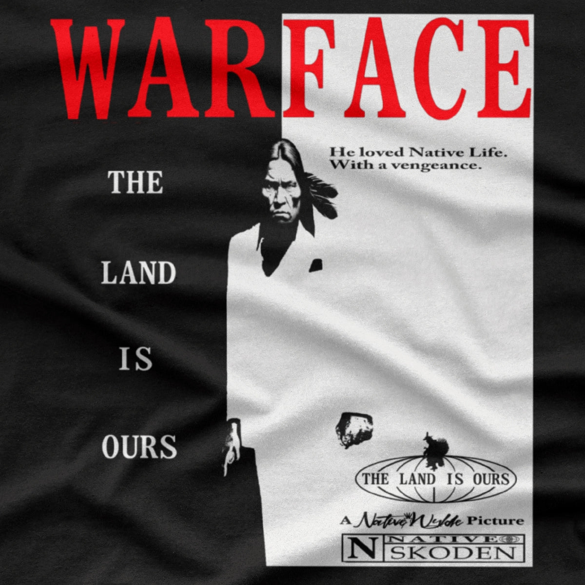 A black short-sleeve t-shirt with a graphic print of the movie 'Warface'. The design features the word 'WARFACE' in bold red letters on the right, next to a black-and-white poster of a soldier, with the text 'THE LAND IS OURS' printed vertically on the left.