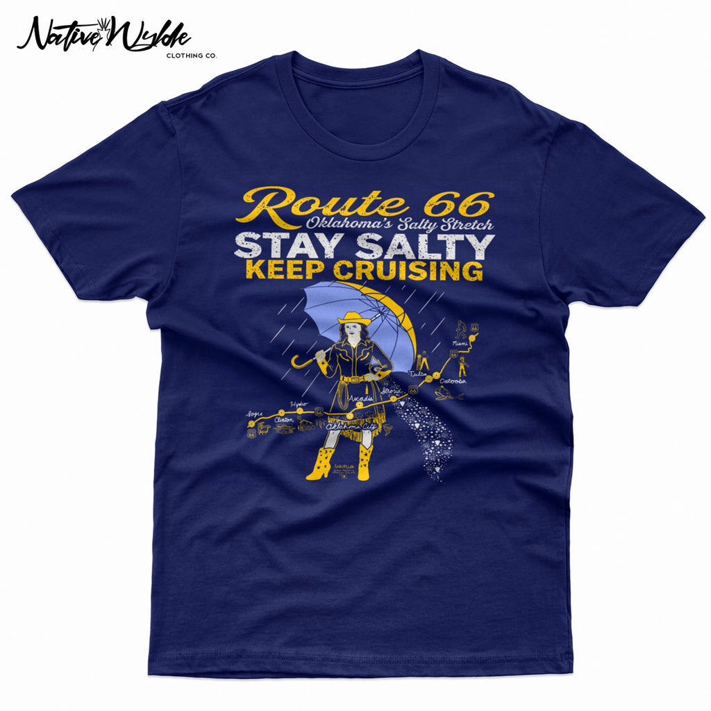 A navy blue graphic print featuring a stylized Route 66 theme with the text 'Route 66 Oklahoma's Salty Stretch', 'STAY SALTY', and 'KEEP CRUISING'. The design includes a woman holding a yellow umbrella, a map with labeled cities, and distressed yellow and white lettering.