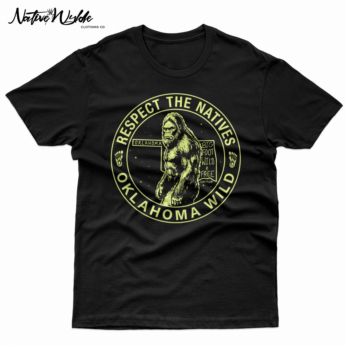 A black short-sleeve crewneck t-shirt featuring a circular graphic print of Bigfoot in the center with the text 'RESPECT THE NATIVES' and 'OKLAHOMA WILD' in bone color around the border. 