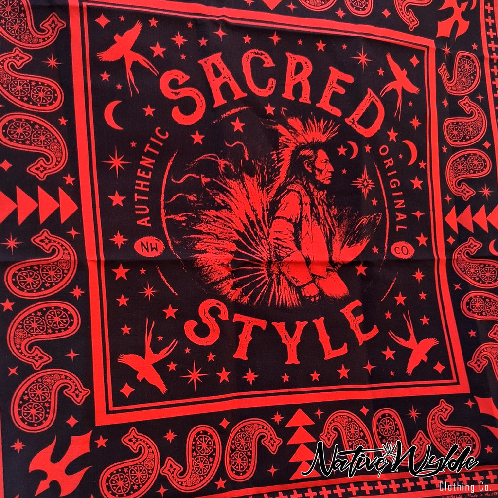 A close-up of a black bandana or scarf featuring a bold red graphic print with the words 'SACRED STYLE' and a central Native American-style figure surrounded by stars, moons, and geometric patterns. A watermark reading 'NativeWekde' appears in the lower right corner.