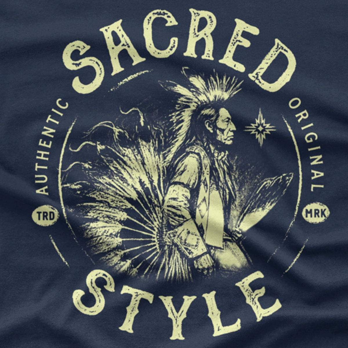 Navy Blue T-Shirt featuring a male Native American dancer with roach. Text says Sacred Style Authentic and Original.